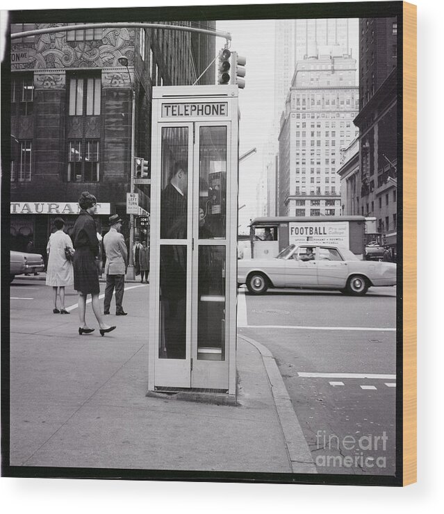 Pedestrian Wood Print featuring the photograph Telephone Booth At 42nd Street by Bettmann