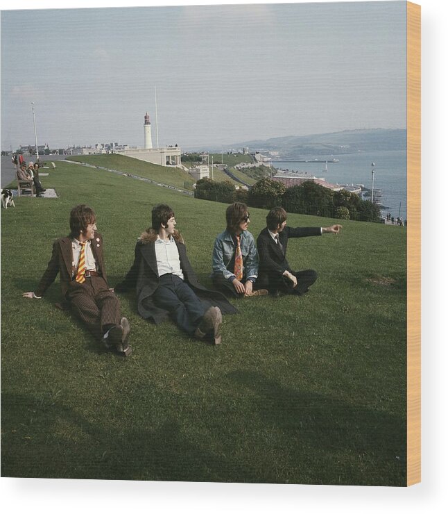 Grass Wood Print featuring the photograph The Beatles On Plymouth Hoe by David Redfern