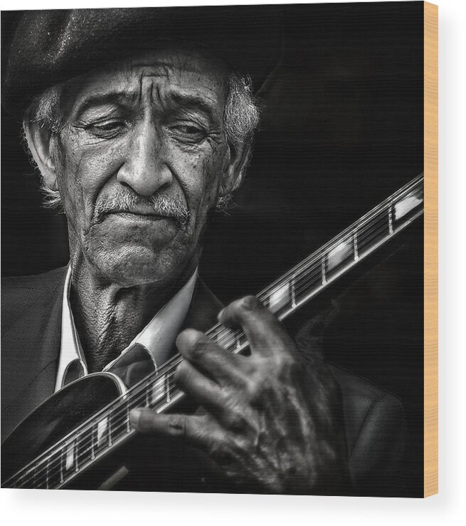 Guitarist Wood Print featuring the photograph The Guitarist by Piet Flour