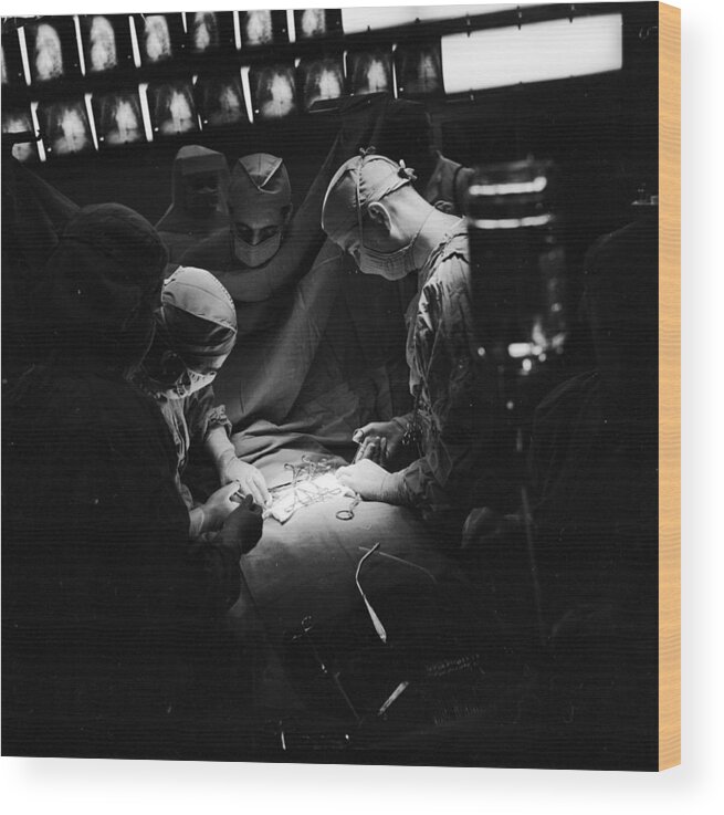 1950-1959 Wood Print featuring the photograph Under The Knife by George Pickow
