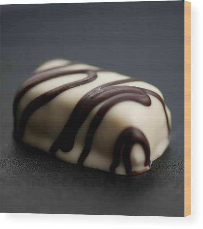 Unhealthy Eating Wood Print featuring the photograph White Chocolate Praline by Christina Børding