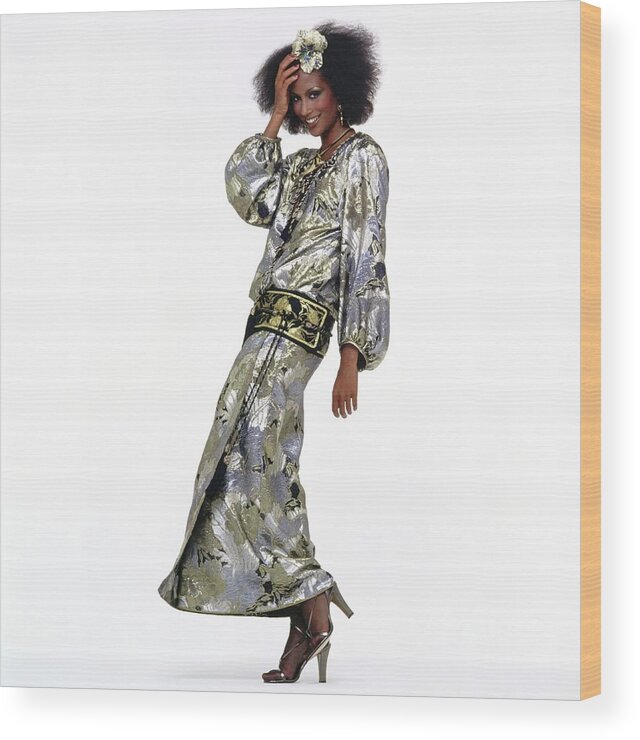 Fashion Wood Print featuring the photograph Beverly Johnson Wearing A Silver Saint Laurent Dress by Albert Watson