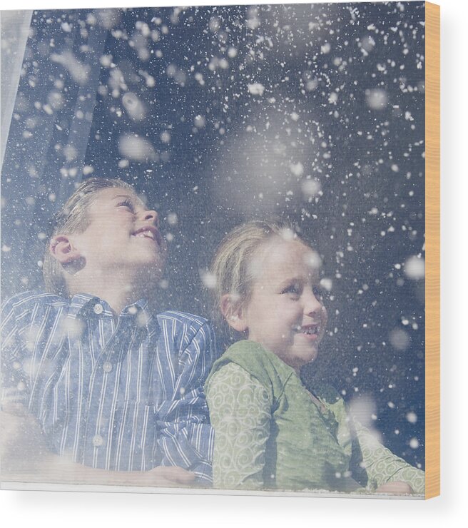 Child Wood Print featuring the photograph Brother and sister looking out window at snow by Jamie Grill