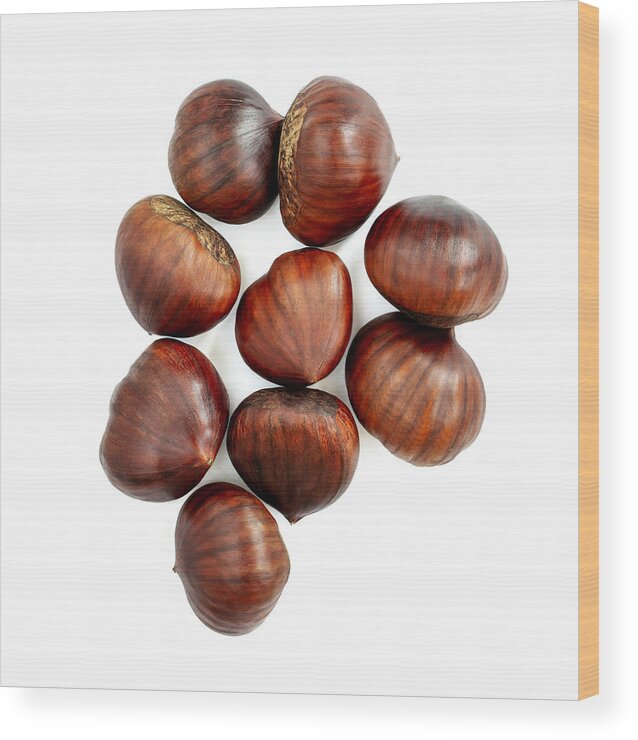 White Background Wood Print featuring the photograph Chestnut Isolated. Roasted sweet chestnuts for Christmas on white background. Food concept. Top view. Flat lay by Zakharova_Natalia