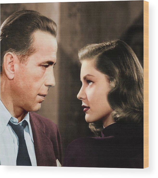 Humphrey Bogart Wood Print featuring the photograph Humphrey Bogart and Lauren Bacall colorized by Movie World Posters