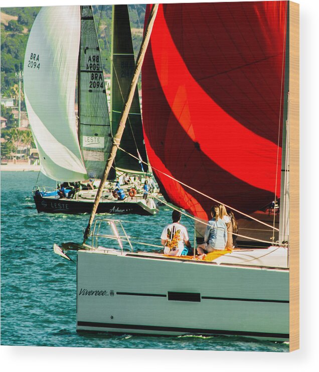 Event Wood Print featuring the photograph Opening of Ilhabela Sailing week when the parade of sailboats happens in front of the píer da vila in Ilhabela, Brazil by Marciopannunzio