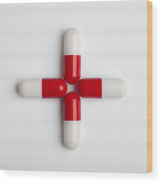 Conceptual Symbol Wood Print featuring the photograph Red pills by Roc Canals