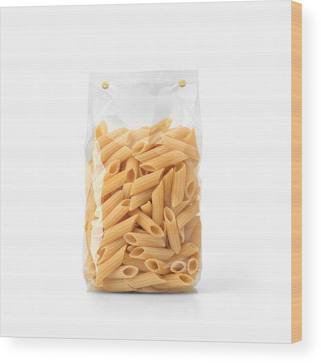 Packet Wood Print featuring the photograph Transparent plastic pasta bag isolated on white background. by Goolyash