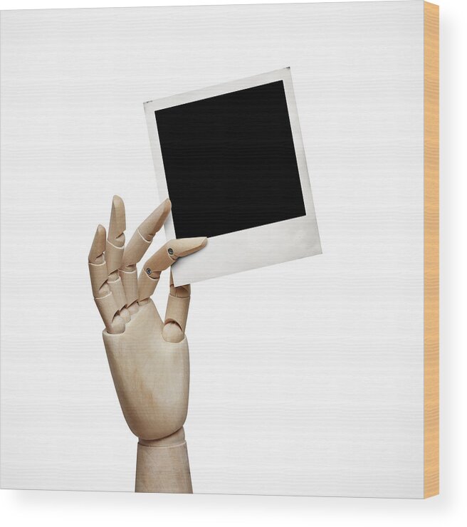 Concepts & Topics Wood Print featuring the photograph Wood hand with instant photo frame by Sfio Cracho
