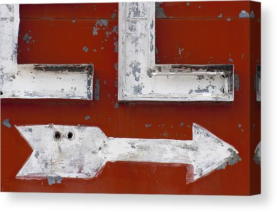 Vintage Arrow Sign on Red Background Canvas Print