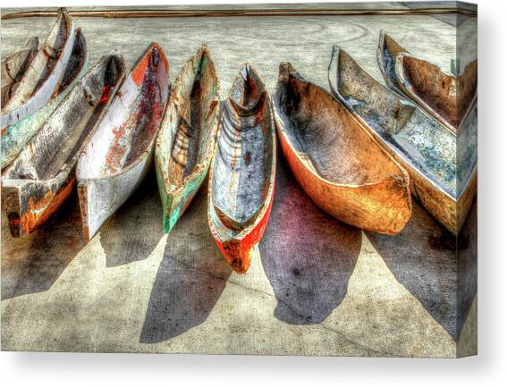 Canoes Canvas Art Print by Debra and Dave Vanderlaan