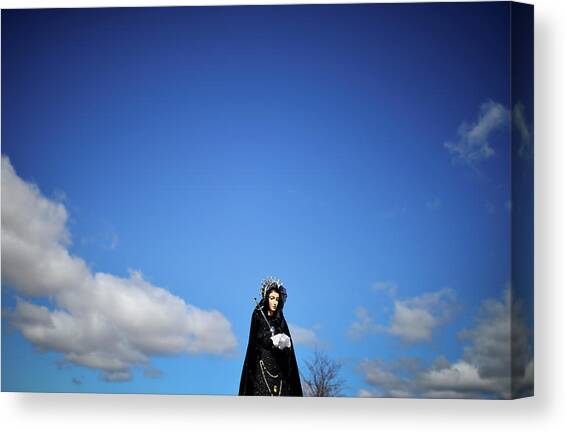 A Religious Statue is Carried Canvas Art Print by Vincent West