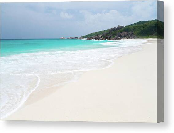 The Beach With White Sand And Turquoise Water With Waves Canvas Art Print by Cavan Images