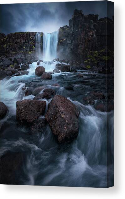 Majestic Waterfall in Rugged Terrain Canvas Print
