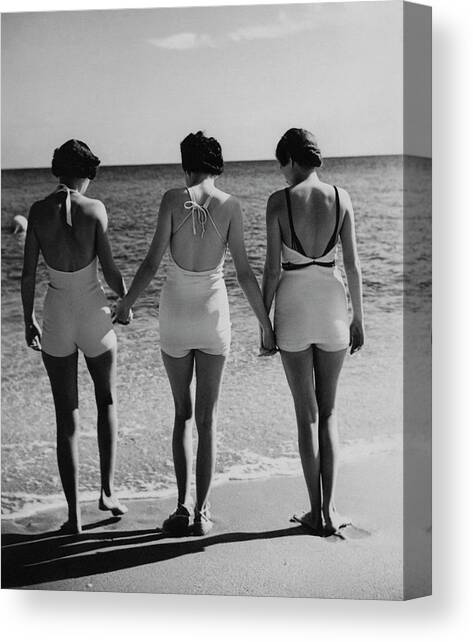 Models On A Beach Canvas Art Print by Toni Frissell