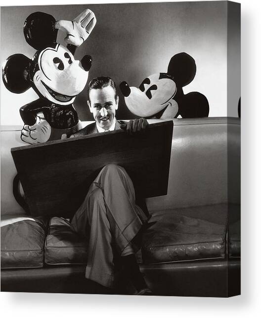 Portrait Of Walt Disney Sitting With Open Cartoon Canvas Art Print by Edward Steichen