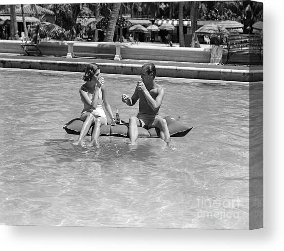 Couple Relaxing In Pool, C.1930-40s Canvas Art Print by H Armstrong Roberts and ClassicStock