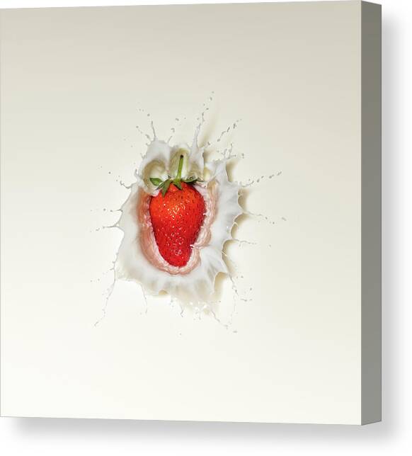 Strawberry splash in milk Canvas Art Print by Johan Swanepoel