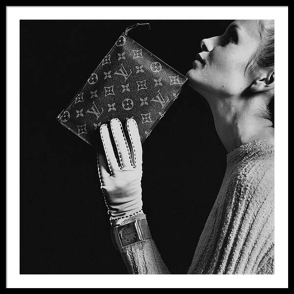 Twiggy Holding Louis Vuitton Envelope Bag by Bert Stern