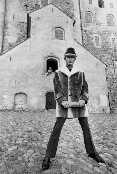 Wall Art - Photograph - A Model In A Double-breasted Coat With Eight by Leonard Nones