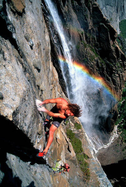 Climbers Ascend A Steep Cliff Art Print