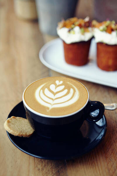 Wall Art - Photograph - Cup Of Coffee With Leaf Pattern On by Jake Curtis