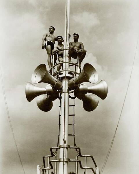 Wall Art - Photograph - The Spence Brothers Sitting At The Top Of A Tower by Lusha Nelson