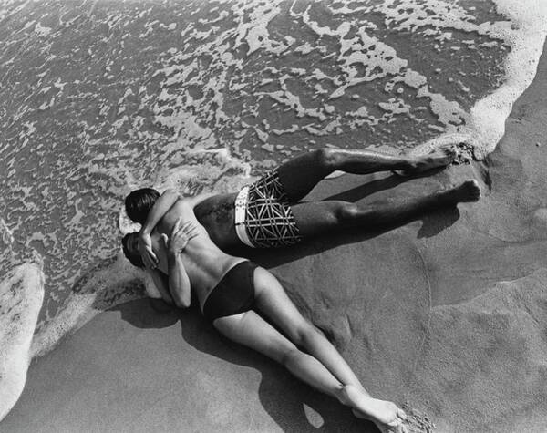 Wall Art - Photograph - Models Embracing On A Beach by Mark Patiky