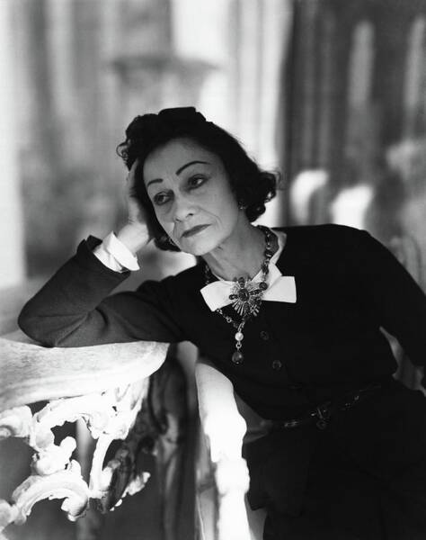 Coco Chanel Leaning On A Table Photograph by Horst P. Horst