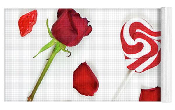 Red roses, petals, lollipops and chocolates creative composition layout.  Photograph by Milleflore Images - Pixels