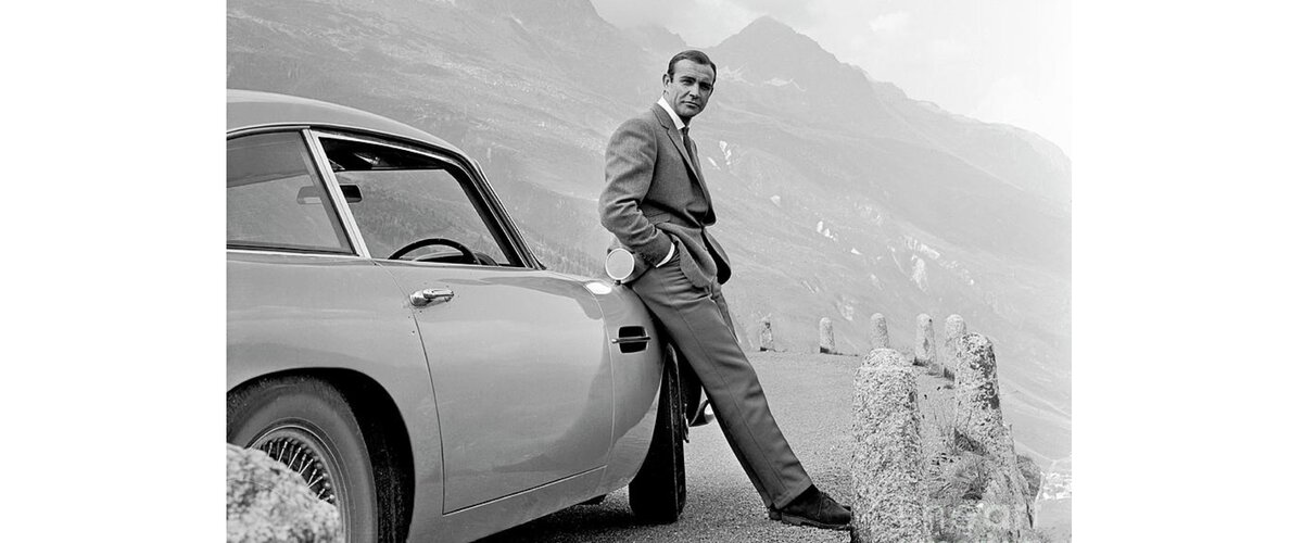 James Bond Coolly Leaning on His Aston Martin Coffee Mug for Sale by ...