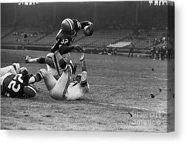 American Football Flying Mid-air by Steven Puetzer