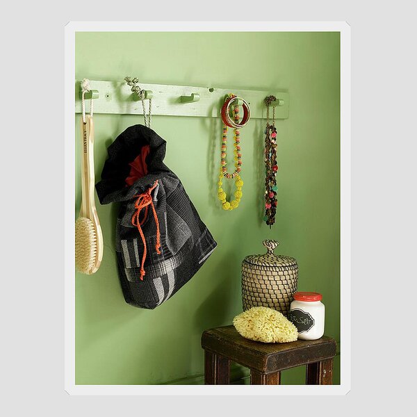 https://render.fineartamerica.com/images/rendered/search/flat/sticker/images/artworkimages/medium/2/green-bathroom-wall-with-wooden-wall-coat-rack-with-jewelry-hanging-from-it-and-a-homemade-fabric-tote-bag-underneath-an-antique-side-table-jo-tyler.jpg?stickerbackgroundcolor=transparent&v=8