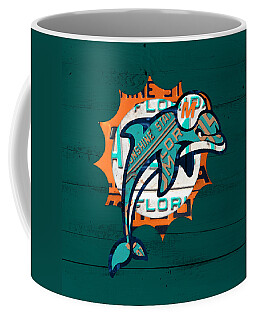 https://render.fineartamerica.com/images/rendered/search/frontright/mug/images-medium-5/miami-dolphins-football-team-retro-logo-florida-license-plate-art-design-turnpike.jpg?&targetx=233&targety=0&imagewidth=333&imageheight=333&modelwidth=800&modelheight=333&backgroundcolor=044945&orientation=0&producttype=coffeemug-11