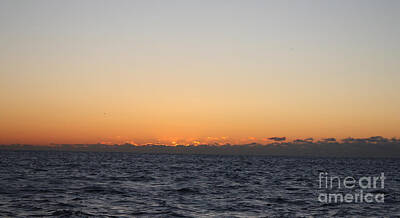 Sun Rising Above Clouds And Horizon Posters