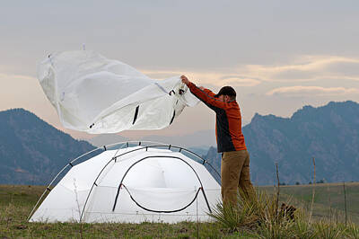 Designs Similar to A Man Setting Up A Tent #1