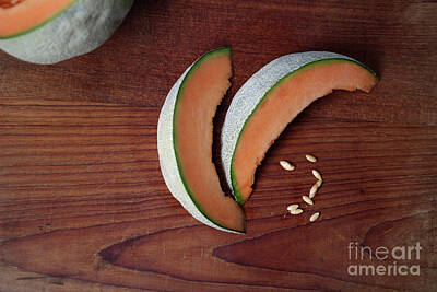  Photograph - Slices of orange, juicy melon on cutting board by Doug Moore