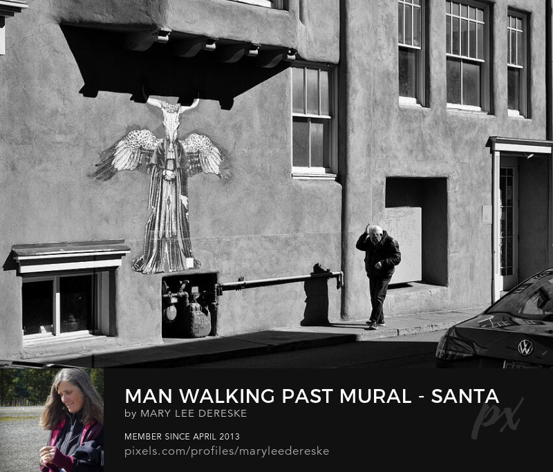 man-walking-past-mural-santa-fe-new-mexioo-b-and-w-mary-lee-dereske