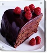 A Chocolate Pecan Cake With Raspberries On Top Acrylic Print