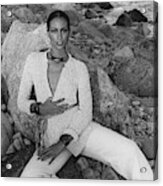 Beverly Johnson Sitting On A Rocky Beach Acrylic Print