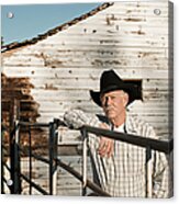 Caucasian Rancher Standing At Gate Acrylic Print