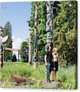 Couple Looking At Totem Poles Acrylic Print