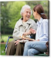 Senior Woman With Caregiver In The Park Acrylic Print