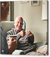 Smiling Senior Man Talking To Female Caregiver Acrylic Print