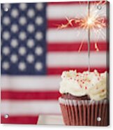 Studio Shot Of Sparkler Atop Cupcake, American Flag In Background Acrylic Print