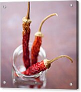 Three Dried Chilies In A Glass Jar Acrylic Print