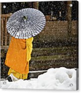 A Buddhist Monk Walks Through A Snow Acrylic Print