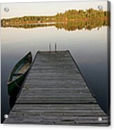 A Canoe Tied To A Wooden Dock On A Acrylic Print
