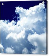 Billowing Masses Of Cumulus Clouds Against A Dark Blue Sky Acrylic Print