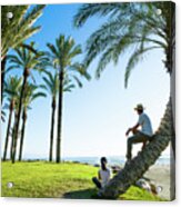 Couple Contemplating The Sea Between Palm Trees On The Beach Of Acrylic Print